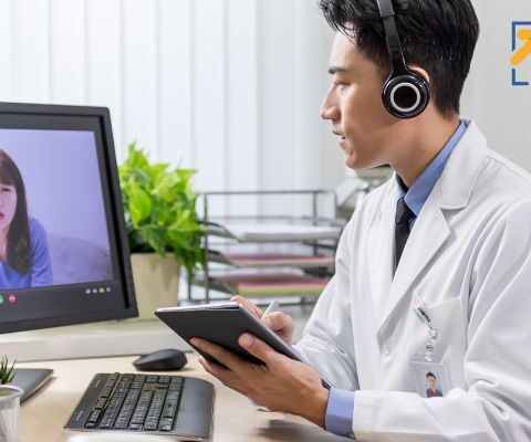 Doctor using a telemedicine kit to see a patient.